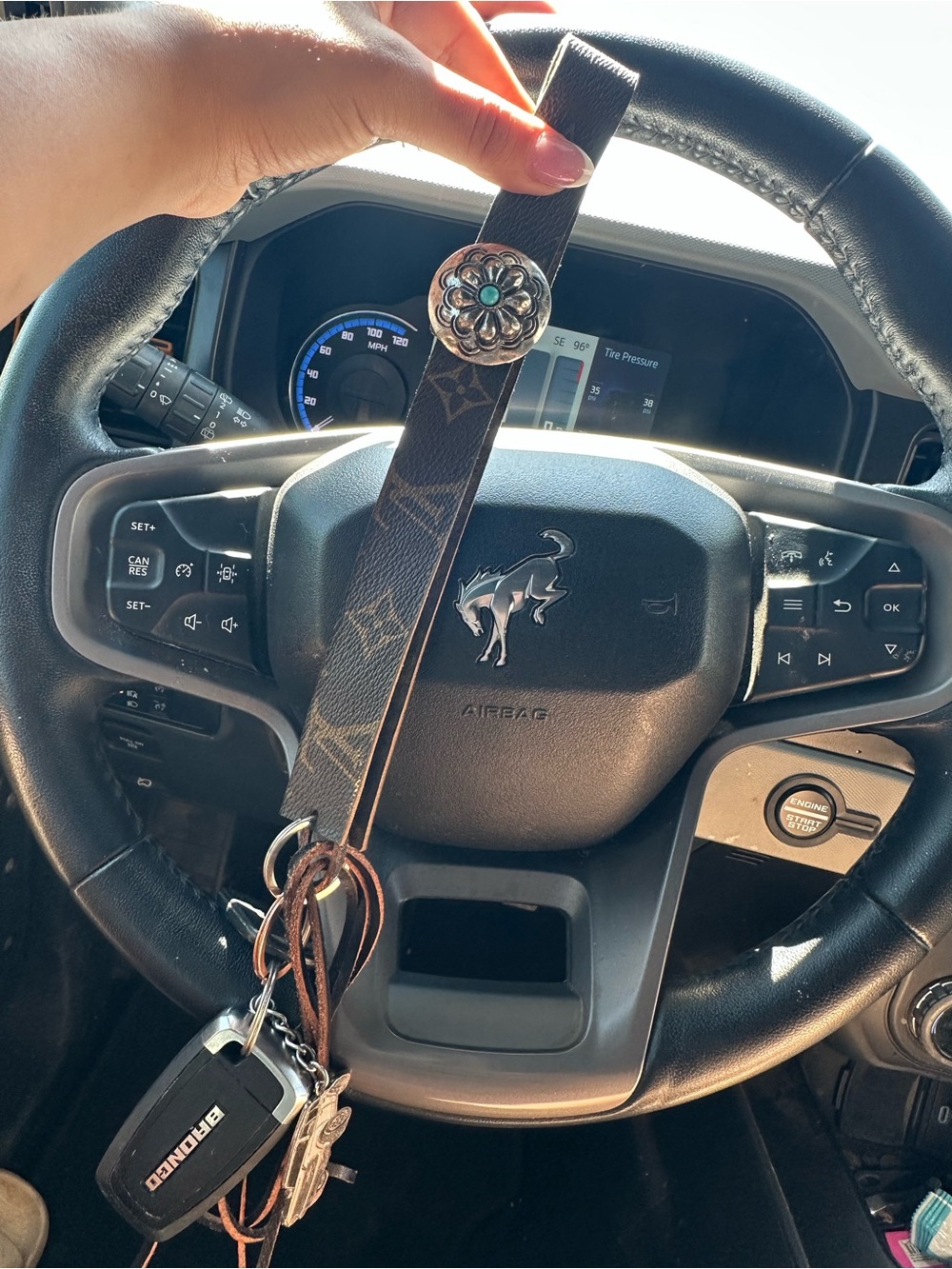 LV revamped Monogram Key Wristlet with Silver-Tone Concho and fringe